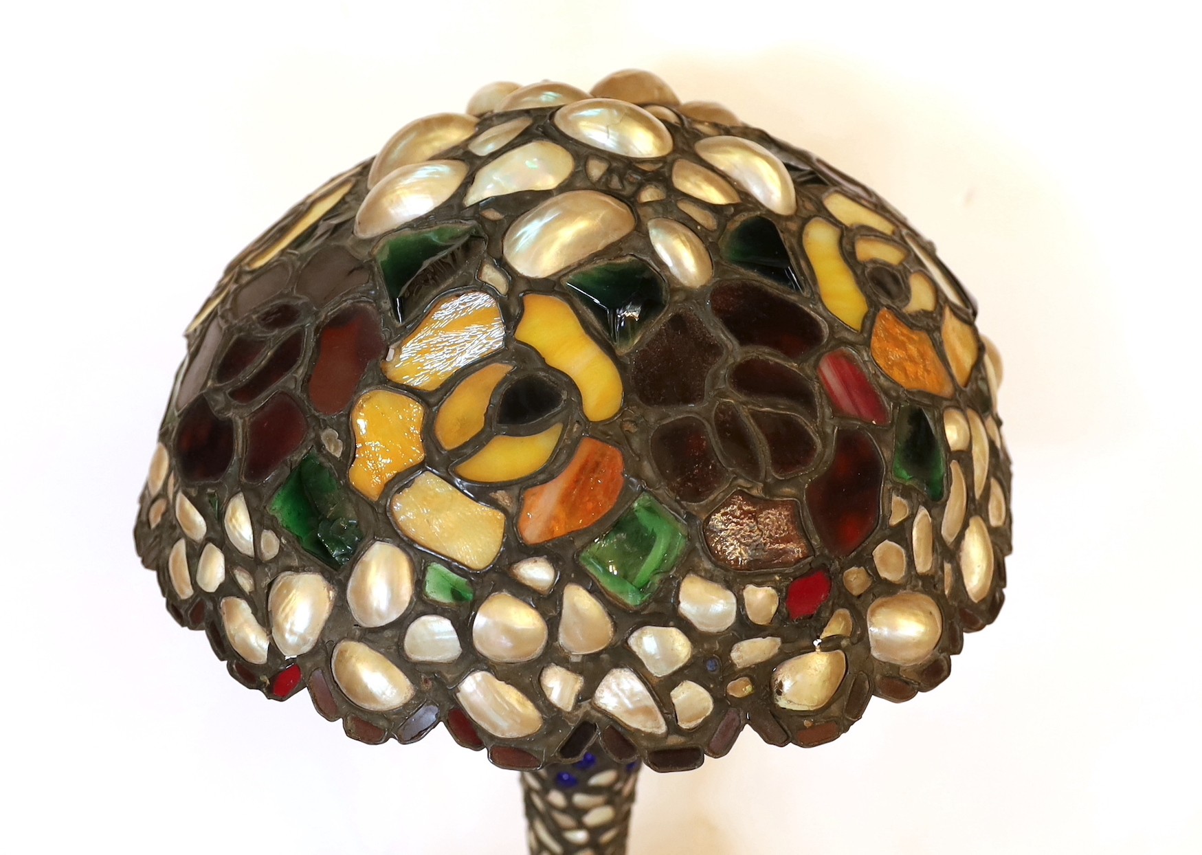 A 1920s Austrian stained glass and mother-of-pearl table lamp with domed shade, height 48cm